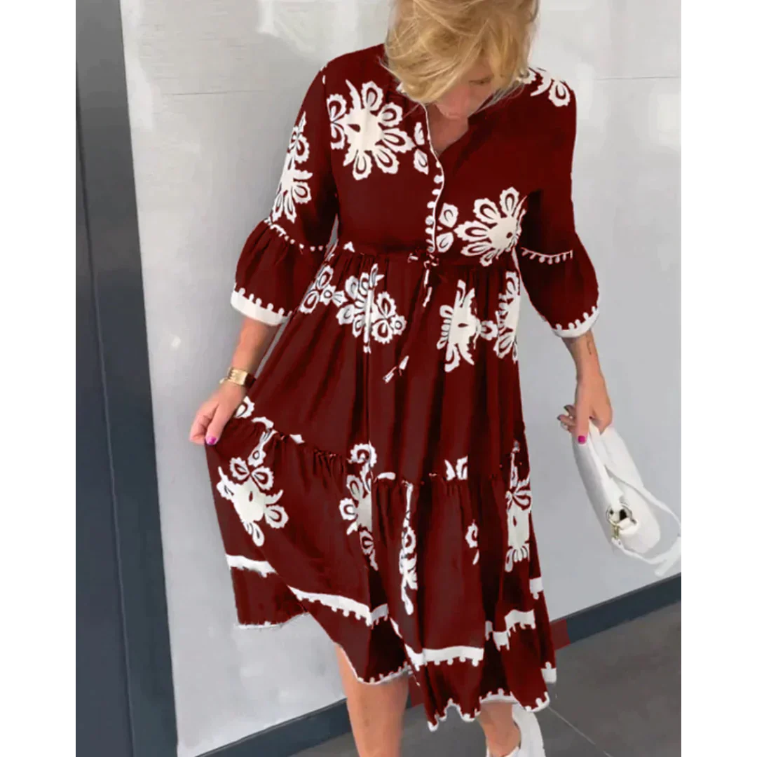 Juliette - Robe fleurie à manches 3/4 avec détails élégants
